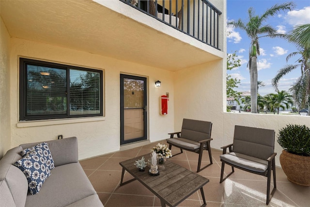 view of patio with a balcony and an outdoor hangout area