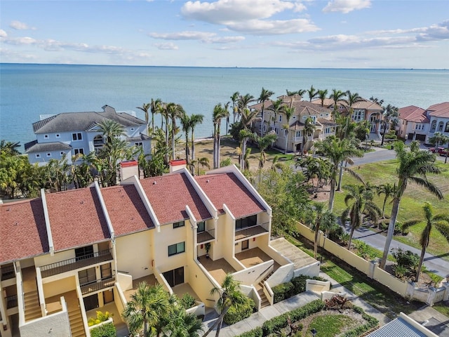 birds eye view of property featuring a water view and a residential view