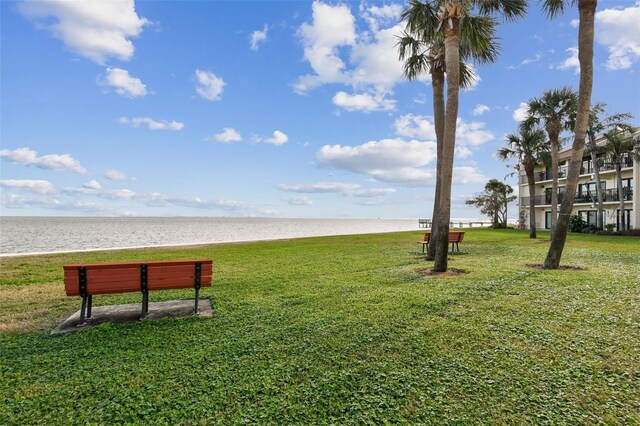 7550 Sunshine Skyway Ln S Unit T48, Saint Petersburg, FL 33711 - surrounding community with view of water and beach and a yard