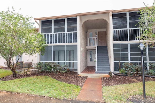 12119 Sunny Glen Ln Unit F1, Hudson, FL 34669 - view of property featuring stairway