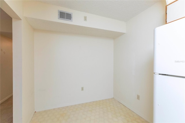 interior space featuring a textured ceiling