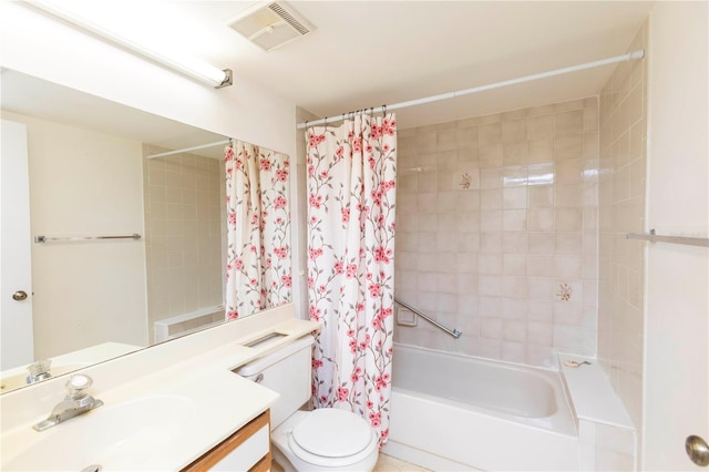 full bathroom featuring vanity, shower / bath combo, and toilet