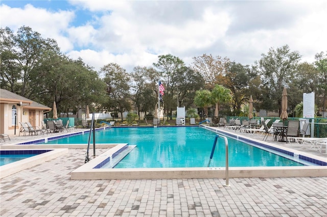 view of swimming pool with a patio area