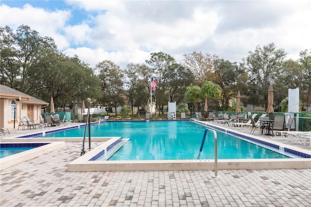 12119 Sunny Glen Ln Unit F1, Hudson, FL 34669 - community pool featuring a patio