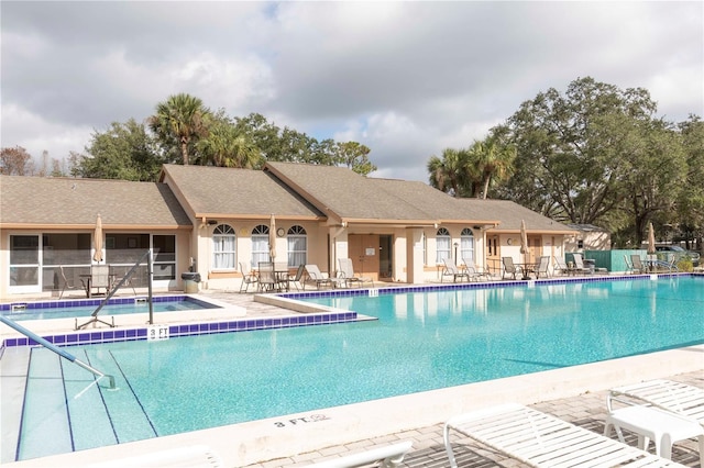 view of swimming pool featuring a patio area