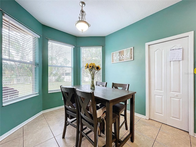 dining area featuring light tile patterned floors