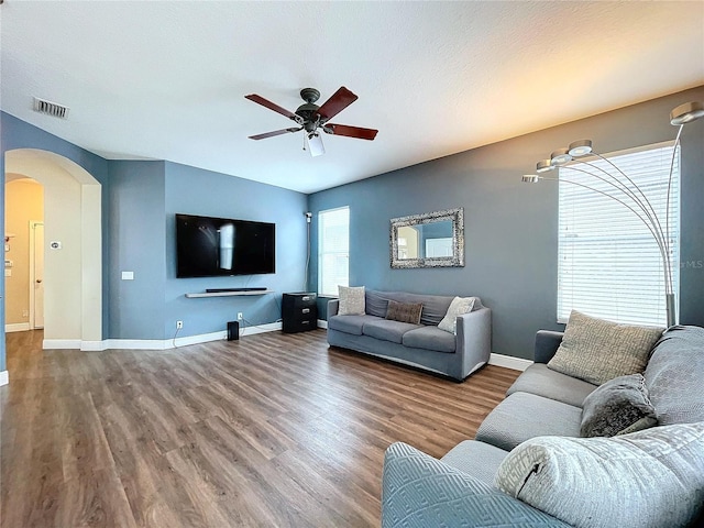 living room with hardwood / wood-style floors and ceiling fan