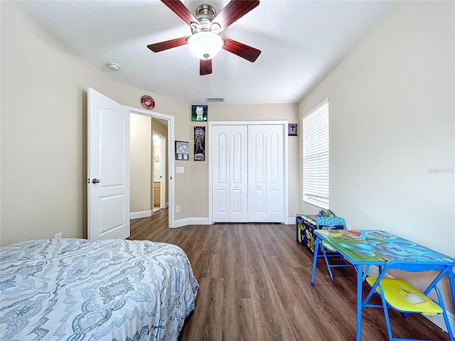 bedroom featuring hardwood / wood-style floors, a closet, and ceiling fan