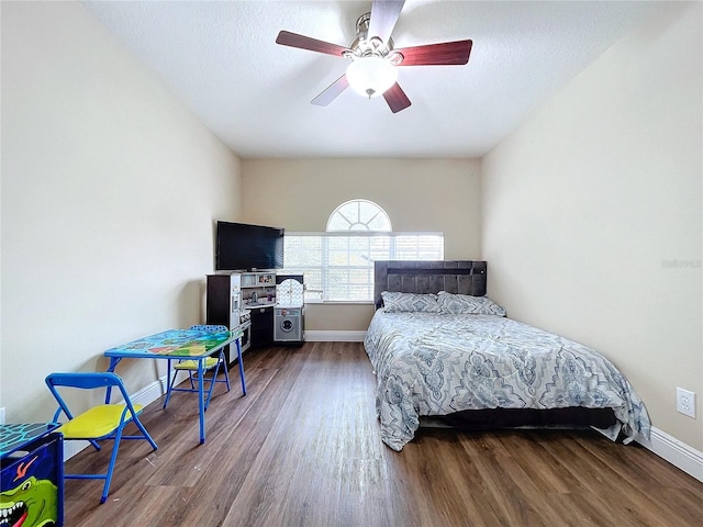 bedroom featuring hardwood / wood-style floors and ceiling fan