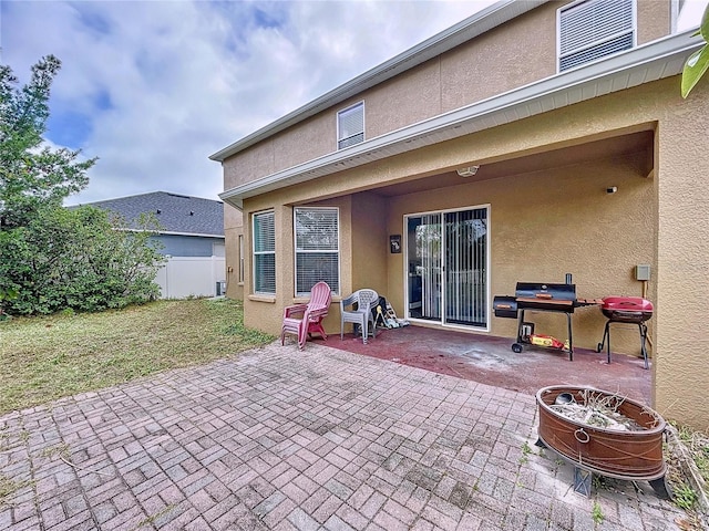 back of property featuring a patio area