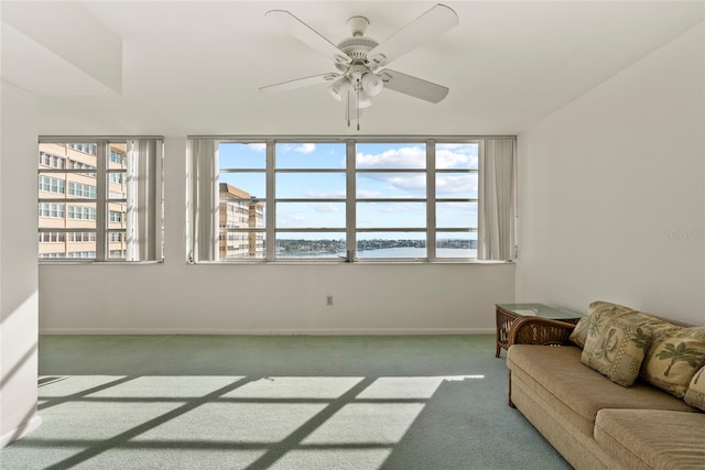 living room with carpet and ceiling fan