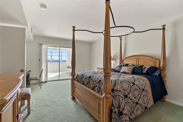 carpeted bedroom featuring access to exterior