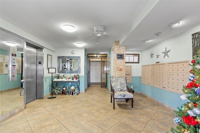 interior space featuring elevator, ceiling fan, light tile patterned flooring, and a mail area