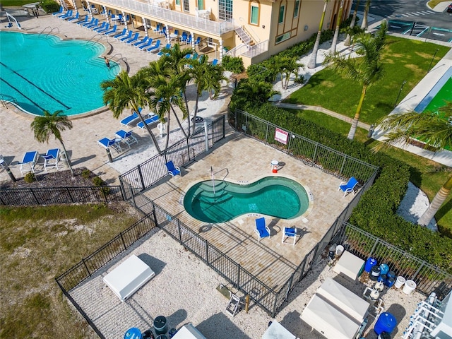 view of swimming pool featuring a patio area