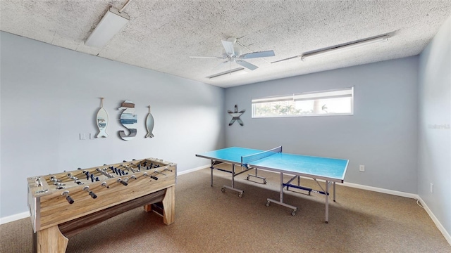 recreation room featuring ceiling fan and a textured ceiling