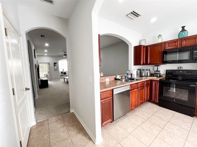 kitchen with ceiling fan, sink, light colored carpet, and black appliances