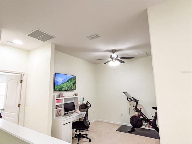 carpeted office featuring ceiling fan