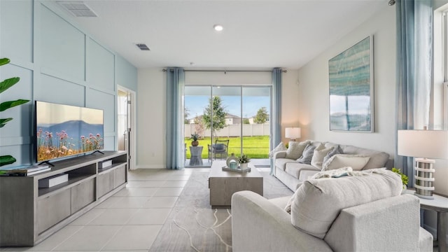 living room with light tile patterned flooring