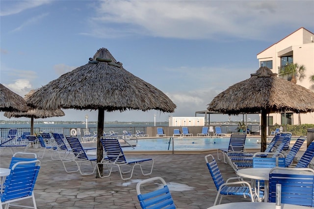 view of patio featuring a gazebo and a community pool