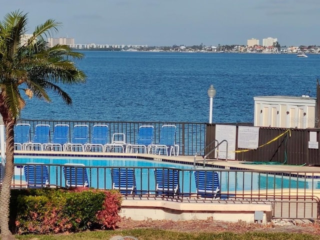 view of pool with a water view