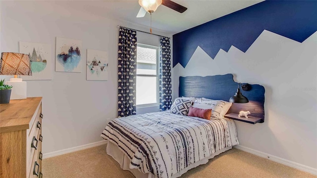 bedroom featuring ceiling fan and light colored carpet