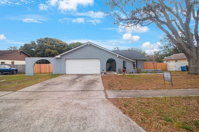 view of front of property featuring a garage and a front yard