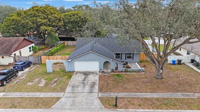 view of front facade featuring a garage and a front yard