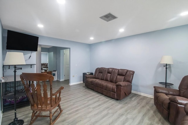 living room with light hardwood / wood-style floors