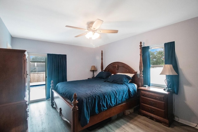 bedroom featuring access to exterior, hardwood / wood-style flooring, and ceiling fan