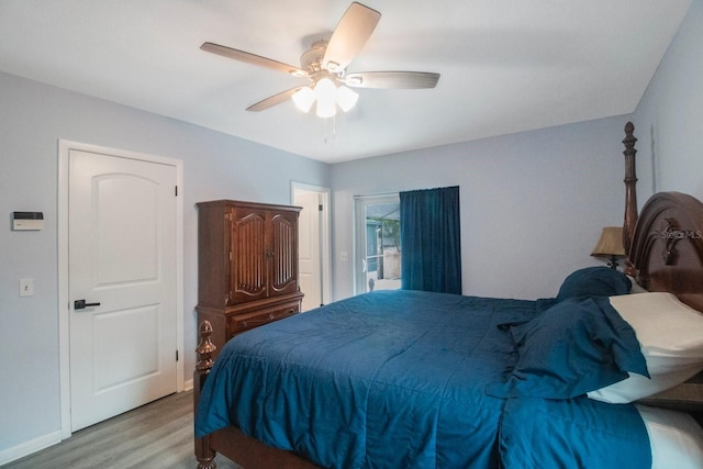 bedroom with light hardwood / wood-style floors and ceiling fan