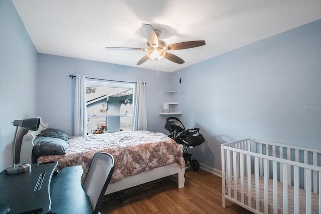 bedroom featuring hardwood / wood-style flooring and ceiling fan