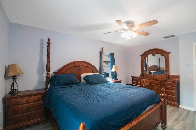 bedroom with light wood-type flooring and ceiling fan