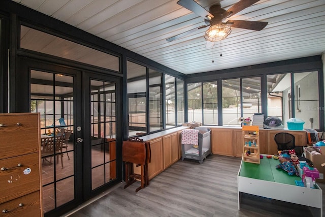 sunroom / solarium with a wealth of natural light and ceiling fan