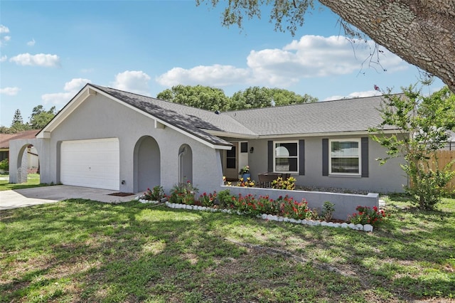 1009 Black Knight Dr, Valrico, FL 33594 - ranch-style house featuring an attached garage, driveway, stucco siding, a shingled roof, and a front lawn