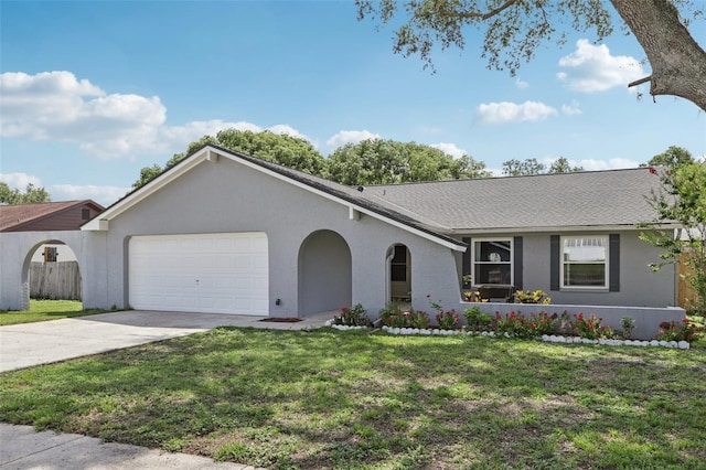 1009 Black Knight Dr, Valrico, FL 33594 - ranch-style house featuring a garage, stucco siding, driveway, and roof with shingles