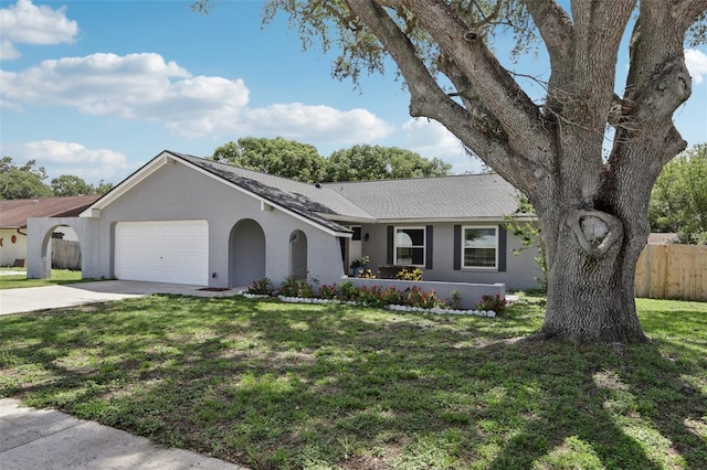 1009 Black Knight Dr, Valrico, FL 33594 - ranch-style home with stucco siding, a garage, driveway, and roof with shingles