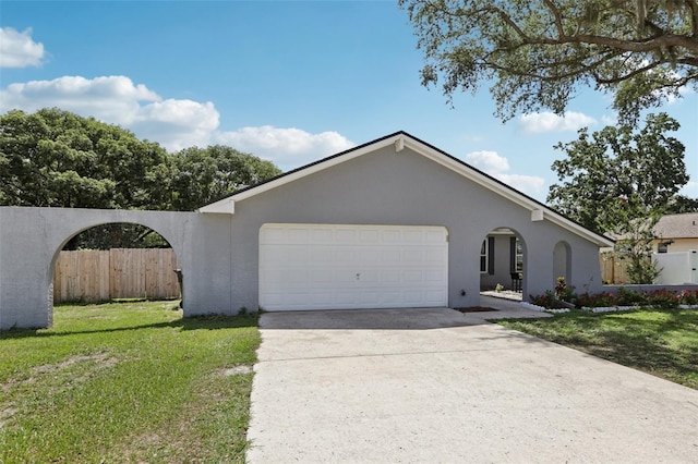 1009 Black Knight Dr, Valrico, FL 33594 - view of front of house with an attached garage, driveway, and stucco siding