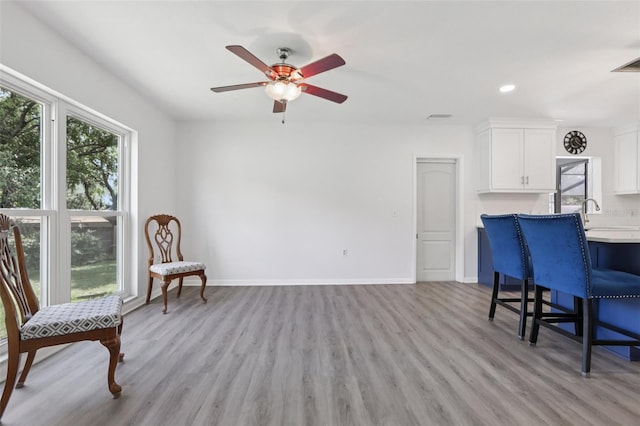 1009 Black Knight Dr, Valrico, FL 33594 - sitting room with a ceiling fan, light wood-type flooring, and recessed lighting