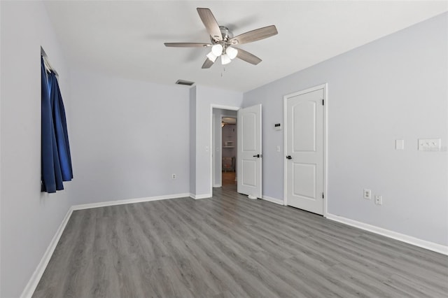 1009 Black Knight Dr, Valrico, FL 33594 - unfurnished bedroom with wood finished floors and ceiling fan