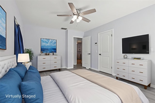 1009 Black Knight Dr, Valrico, FL 33594 - bedroom featuring wood finished floors and ceiling fan