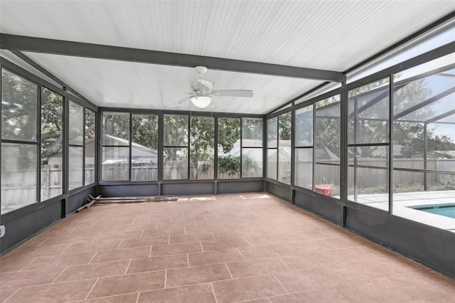 1009 Black Knight Dr, Valrico, FL 33594 - unfurnished sunroom featuring a ceiling fan and beamed ceiling