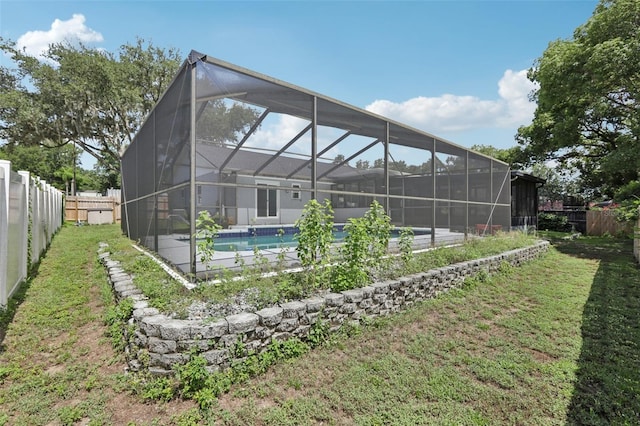 1009 Black Knight Dr, Valrico, FL 33594 - back of house with a fenced backyard and a lanai