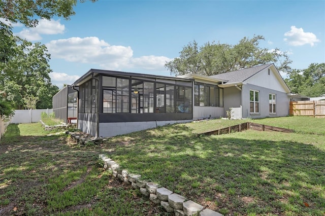 1009 Black Knight Dr, Valrico, FL 33594 - back of house with a sunroom and a fenced backyard