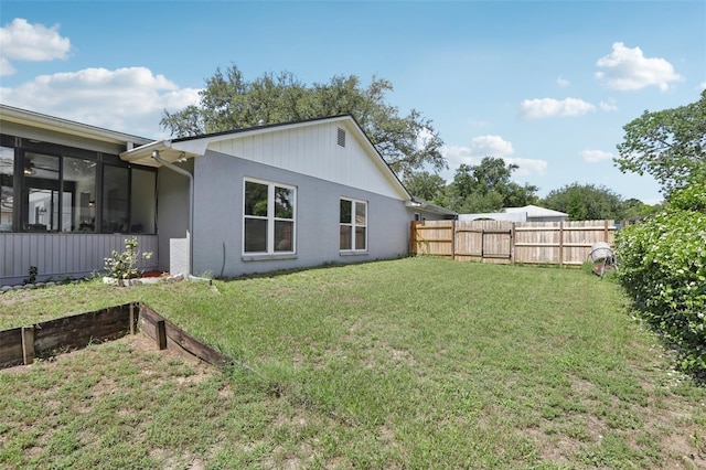 1009 Black Knight Dr, Valrico, FL 33594 - rear view of property featuring a fenced backyard and a sunroom