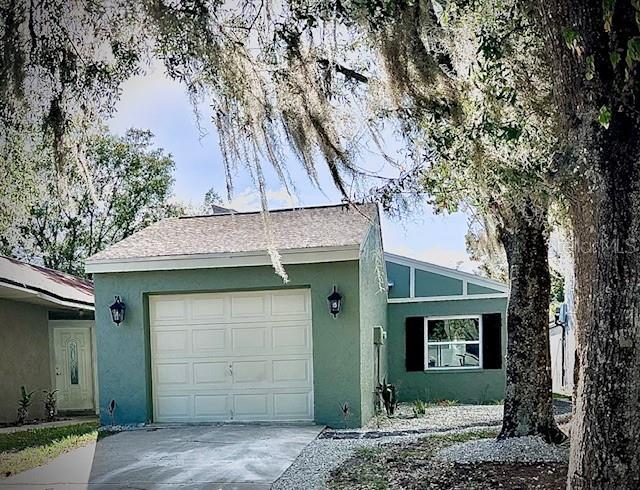 single story home featuring a garage