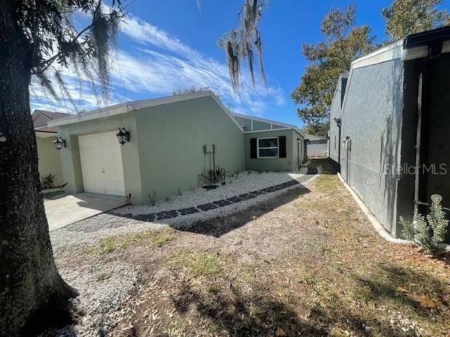 view of property exterior with a garage