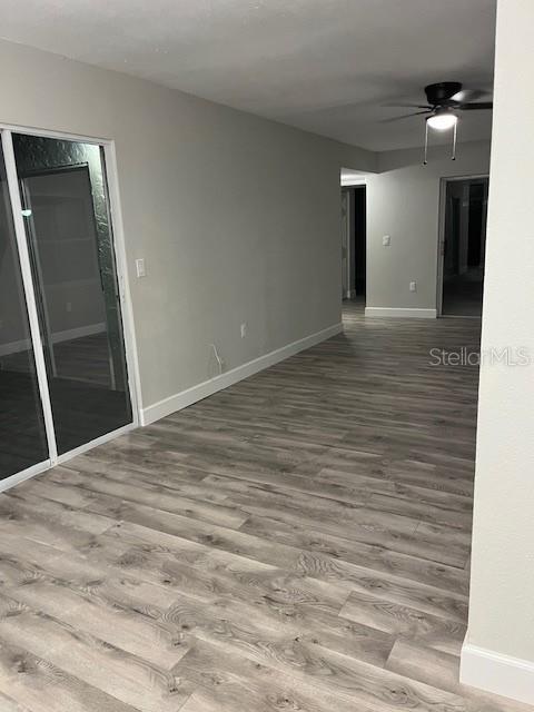 spare room featuring ceiling fan and hardwood / wood-style flooring