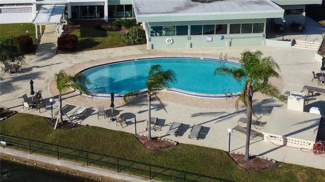 view of swimming pool featuring a patio area