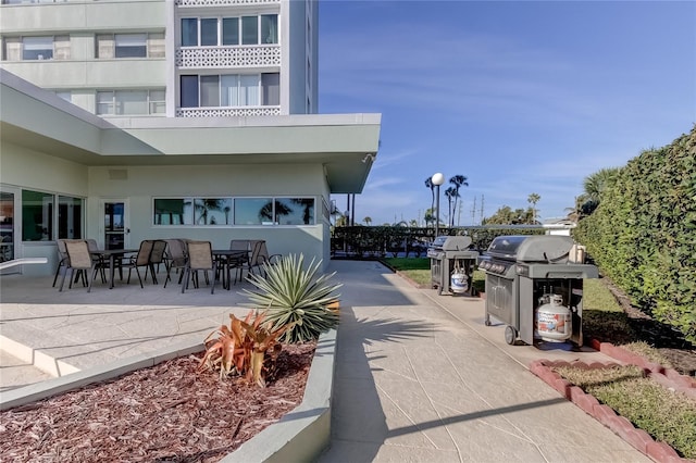 view of home's community with a patio area