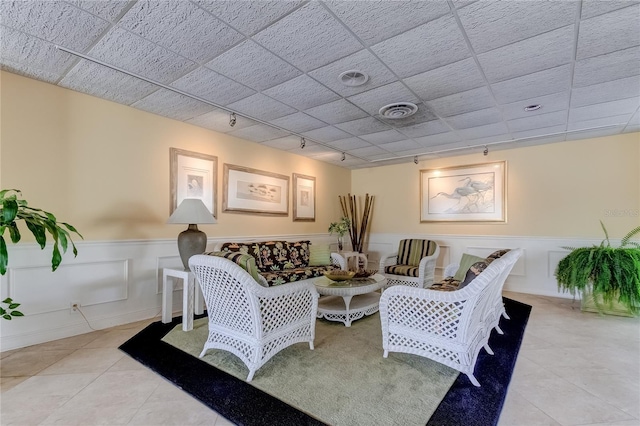 tiled living room with rail lighting